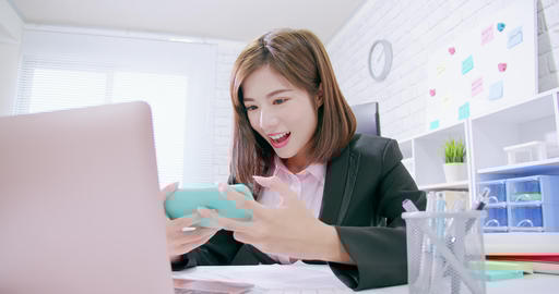 business woman play mobile game